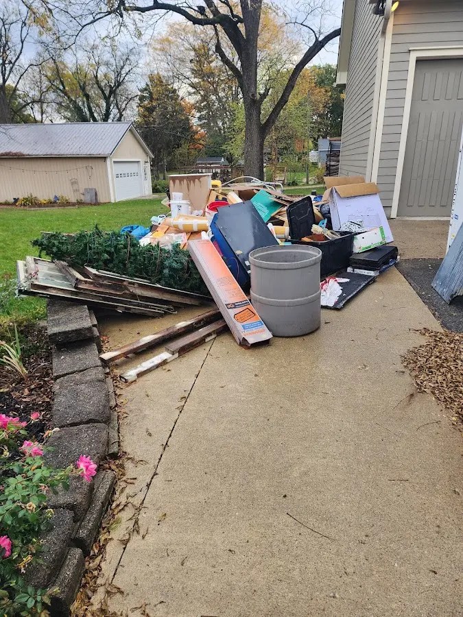 Dumpster being loaded with debris for Roofing Dumpster Rental in Vernon